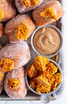 doughnuts and dipping sauce on a tray