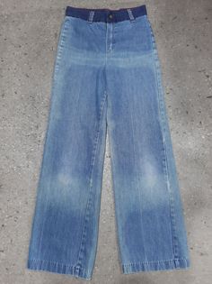 "Rare 70s denim bell-bottom flares with back pocket detail of embroidered parrots. Features dark denim pockets and waistband with contrast orange stitching. Such an individual piece! Tag sz. 14 (likely a child size, see measurements) Measurements taken laying flat: Waistband: 13.5\" Hips: 16\" Back Rise: 14\" Front Rise: 12\" Inseam: 28\" In worn, vintage condition. Fading and yellowing present throughout, as pictured, as well as a discolouration mark on the back of the left leg which can be see 1970s Style Denim Bottoms With Pockets, 1970s Style Full Length Denim Bottoms, 1970s Denim Bottoms With Pockets, 1970s Fitted Denim Jeans, 1970s Fitted Denim Bottoms, 70s Denim, Embroidered Pocket, Denim Pocket, American Rag