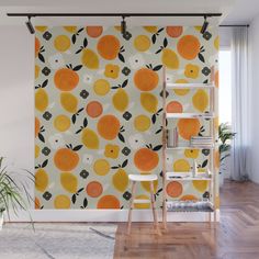 an orange and black pattern on a white wallpaper mural in a room with wooden flooring