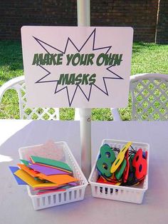 there is a sign that says make your own masks in front of some plastic bins