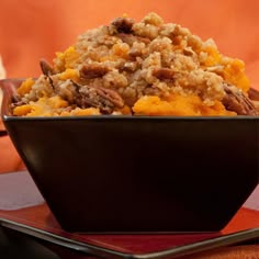 a bowl filled with food sitting on top of a table