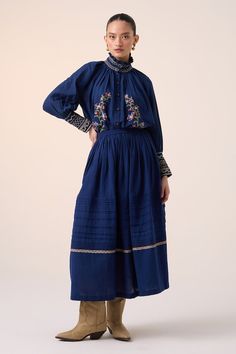 Blue top with pixel embroidered floral vine motifs, scalloped hem and smocked details. Comes with long skirt featuring pintuck hem and lace embellishments. - Aza Fashions Blue Folk Style Top With Embroidered Hem, Blue Embroidered Long Skirt, Blue Floral Embroidery Skirt For Spring, Fitted Blue Skirt With Floral Embroidery, Long Blue Embroidered Skirt, Traditional Blue Bottoms With Floral Embroidery, Top With Skirt, Floral Embroidered Top, Lace Bands