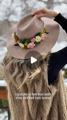 a woman wearing a hat with flowers on it's brim and the words, update a felt hat with this diy felt hot band