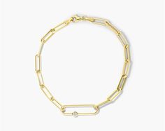 14K Yellow Gold Oval Link Paper Clip Bracelet. This striking paperclip bracelet has a bold oversized link with a diamond accent. The bracelet secures with a lobster claw clasp. Clic Cadenas Bracelet, Diamond Bracelets, Paper Clip, Gold Bracelet, Jewelry Bracelets, Yellow Gold, Yellow, Gold