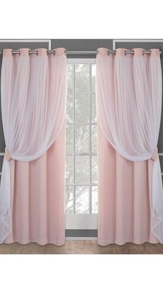 pink curtains hanging on the side of a window