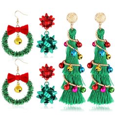 christmas tree earrings with bows and bells on them, all decorated in green fringes