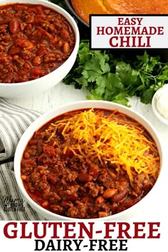 two white bowls filled with chili and cheese