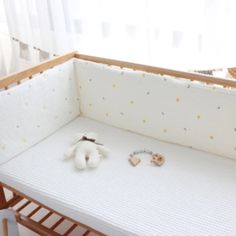 a baby crib that has some toys on it