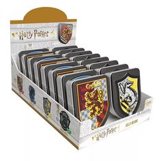 a display case with harry potter emblems on it