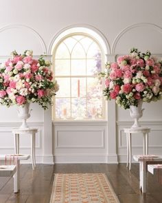 three vases filled with pink and white flowers