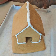 a gingerbread house with icing on it