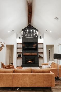 a living room with two couches and a fireplace