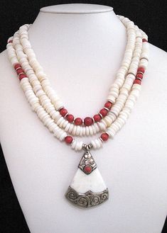 "Tibetan silver, coral and white shell pendant with white shell and coral necklace white shell slices red round coral beads silver heishi diamond cut silver beads silver toggle clasp Tibetan shell, coral and silver pendant Length: 24\" - \"WHITE SHELLS\"" Unique White Shell Necklace With Round Beads, White Shell-shaped Necklaces For Jewelry Making, Summer White Shell-shaped Necklace, Unique White Shell-shaped Necklace, Bohemian White Shell-shaped Pearl Necklace, Coral Necklace, Coral Beads, Shell Pendant, Shell Necklaces