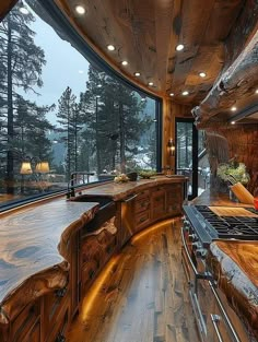 a large kitchen with wooden cabinets and counter tops