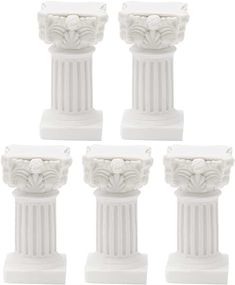 four white pedestals with flowers and leaves on the top, set of six pieces