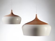 two white and brown lights hanging from the ceiling