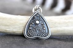 "This listing is for one gorgeously detailed and old timey sterling silver celestial Ouija planchette necklace featuring a detailed and dimensional planchette  with a crescent moon, star, and eye above dancing skeletons and the eye of the planchette. It's a very strange and beautifully unique pendant. I make these witchy pendants 100% by hand using sterling silver sheet and steel dies made as replicas of vintage jewelry designs in my hydraulic press, slowly forging the sheet into the shape. I th Planchette Necklace, Mystic Style, Celestial Pendant, Skeleton Necklace, Ouija Planchette, Necklace Evil Eye, Witch Necklace, Hydraulic Press, Dancing Skeletons