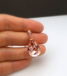 Swarovski vintage rose blush pink faceted foiled back vintage style teardrop rhinestone with rose gold plated frame pendant. rose gold plated brass bail decorated with luxury cubic zirconia. Rose gold sterling silver chain or adjustable rose gold plated brass chain. Pendant size with bail: 3cm x 1.4cm Matching earrings https://www.etsy.com/listing/259266561/bridesmaid-gift-prom-swarovski-vintage?ref=listings_manager_grid Rose Gold Frame, Rose Blush, Pink Vintage, Vintage Rose, Crystal Drop, Bridal Necklace, Bridesmaid Earrings, Chain Pendant, Silver Chain Necklace