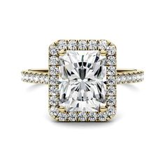 a cushion cut diamond surrounded by pave set halos in 18k white gold