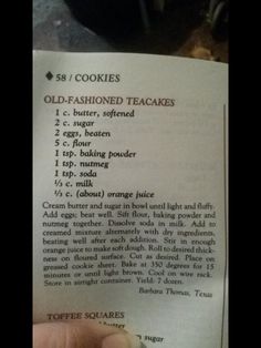 someone is holding up a recipe for cookies