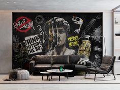 a living room filled with furniture and a mural on the wall above it's couch