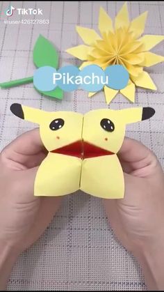 someone is making a paper pikachu