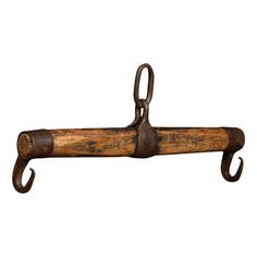 an old wooden handle hanging from a hook