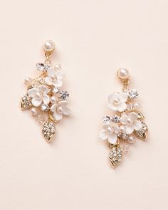 two pairs of earrings with pearls and crystal stones on them, one in gold tone