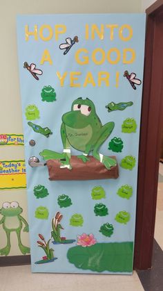 a bulletin board with a frog on it and words that say, hop into a good year