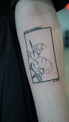 a black and white photo with flowers on the left side of the arm that says, i am yourself