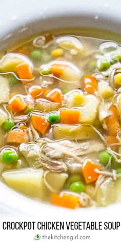 a white bowl filled with chicken vegetable soup