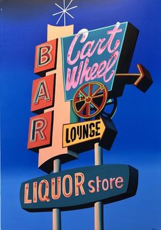 a colorful sign for a liquor store on the side of a building in front of a blue sky