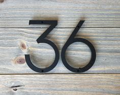 the number fifty is placed on a wooden surface