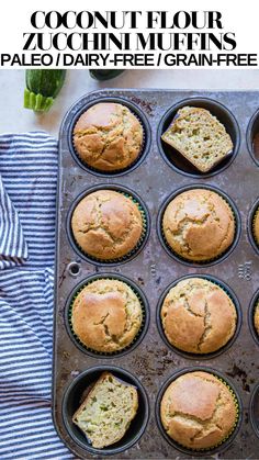 freshly baked muffins in a baking pan with zucchini on the side