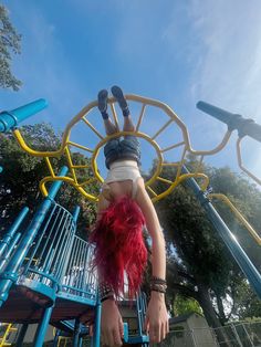 a person is upside down on a playground