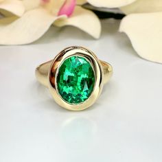 This is a Oval emerald statement ring set in 14k solid gold. This mens emerald green ring makes a great promise, anniversary ring. The  Mens May birthstone ring can also be a emerald pinky ring or emerald signet ring, This ring is an oval lab created emerald bezel set unisex ring, 14k yellow gold #6290 We feature the finest quality lab grown emeralds in the world.  The properties of lab-grown are physically, chemically and visually identical to natural, just grown in a lab setting. Emerald is th Luxury Formal Emerald Signet Ring, Luxury Green Emerald Ring With Smooth Bezel, Emerald Signet Ring, Emerald Green Ring, Emerald Statement Ring, May Birthstone Rings, Green Ring, Green Rings, Lab Created Emerald