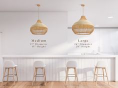 three white stools in front of a bar with hanging lights above it and the name large written on the wall behind them