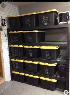 the shelves are filled with black and yellow bins