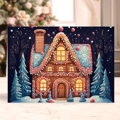 a christmas card with a gingerbread house on it