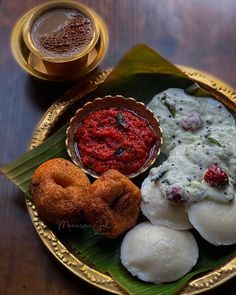 an assortment of food on a plate with sauces and condiments next to it