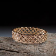 Celtic gold ring A Somewhat rugged textured gold ring featuring a single and repeating Celtic art pattern in a Eternity band 360 style. Rich in delicate textures and scratches giving it a slightly antique and rugged look Very comfortable and easy to wear for days. With Each Ring made by hand this Celtic gold ring every ring is a perfect fit Made to last from Solid Gold or Sterling Silver. Free Shipping worldwide! Ring Shown in pictures is 14 Karat Gold Size 8, All sizes available2 The ring width Elegant Gold Band Rings, Gold Etched Bands As Gift, Gold Etched Band As Gift, Gold Filigree Jewelry For Promise Ring, Gold Etched Bands For Gifts, Gold Etched Bands For Gift, Stackable Band Gold Rings, Stackable Gold Band Rings, Gold Promise Ring With Intricate Design