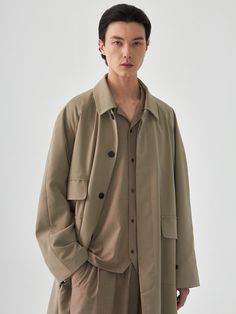 Editor's NotesCord.’s balmacaan coat features oversized fit, minimal silhouette, and flap pockets.- Button hole detail for collar and detachable hood- Hidden button closure- Long sleeves- Oversized fit- Chest and front flap pocketsMeasurements(in.)M / L- Chest: 26.8in. / 28.0in.- Sleeve: 30.7in. / 31.9in.- Length: 43.7in. / 44.9in.*Model Info: 6’1’’ Fitting Size LComposition & Care- (Outshell) 79% Polyester, 18% Rayon, 3% Spandex (Lining) 100% Polyester- Dry clean or hand-wash in lukewarm wa Gabardine Pea Coat With Pockets, Oversized Solid Single Breasted Outerwear, Long Sleeve Gabardine Pea Coat With Pockets, Khaki Single-breasted Outerwear With Lapel Collar, Classic Oversized Outerwear With Button Cuffs, Oversized Khaki Outerwear With Flap Pockets, Oversized Casual Pea Coat With Button Closure, Oversized Collared Outerwear For Everyday, Khaki Long Coat With Button Cuffs