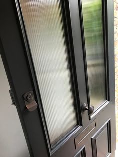 the door is closed and there are two glass doors on each side of the door