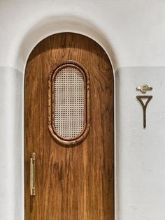 the door is made of wood and has a metal handle on it's side