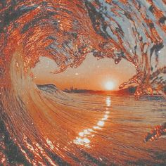 an orange and white photo of the inside of a wave with water swirling around it