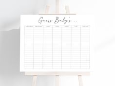 a sign with the words gross baby's written on it next to a easel