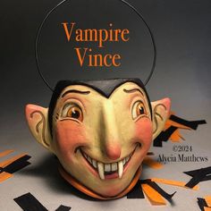 a halloween mask with a vampire's head and the words vampire vince on it