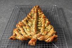 there is a large pastry on a cooling rack with some sort of thing in it