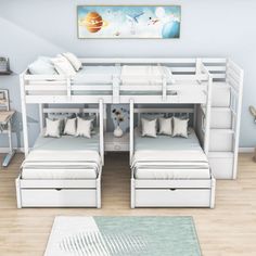 the bunk bed is white and has drawers underneath it