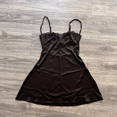 Nwot Better Fit For B/C Cup Girlies. The Back Is Elastic So Its Super Comfy And Flattering (The Pic Came Out Looking Velvety? But Its More Of A Satin Finish) Flirty Black Satin Slip Dress, Black V-neck Slip Dress For Loungewear, Black V-neck Sleep Dress, Black Lace Trim Camisole Slip Dress, Black Camisole Slip Dress With Built-in Bra, Black Slip Dress, Black Laces, Slip Dress, Super Cute